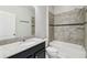 Bathroom featuring a granite vanity, a bathtub and shower combo, and a modern toilet at 1553 Amber Leaf Cir, Ocoee, FL 34761
