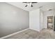 Bedroom with neutral walls, carpet floors, and an entrance door leading to other spaces at 1553 Amber Leaf Cir, Ocoee, FL 34761