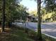 Gated community entrance featuring stone accents and lush landscaping at 1553 Amber Leaf Cir, Ocoee, FL 34761
