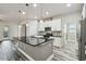Spacious kitchen with a large island, stainless steel appliances, and wood-look flooring at 1553 Amber Leaf Cir, Ocoee, FL 34761