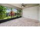 Outdoor patio with brick flooring and a screen, with a landscaped yard beyond providing natural light at 1553 Amber Leaf Cir, Ocoee, FL 34761