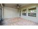 Outdoor patio with brick flooring, a ceiling fan, and a screen, providing natural light at 1553 Amber Leaf Cir, Ocoee, FL 34761