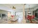 Bright and airy living room featuring a ceiling fan, natural light, and open floorplan at 17567 Se 81St Parnassus Ct, The Villages, FL 32162