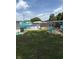Backyard with an above-ground pool, a cozy firepit, and lounge chairs, ideal for relaxation and entertaining at 3439 Swindell Rd, Lakeland, FL 33810