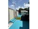 Backyard showing sheds, blue deck, and a grill, perfect for outdoor entertaining at 3439 Swindell Rd, Lakeland, FL 33810