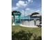 Above-ground pool with a blue deck, set in a grassy backyard, ideal for summer fun at 3439 Swindell Rd, Lakeland, FL 33810