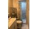 Bathroom featuring a shower with patterned curtain and adjacent shelf at 3439 Swindell Rd, Lakeland, FL 33810