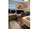 Bedroom featuring desk area, artwork and light ceiling fan at 3439 Swindell Rd, Lakeland, FL 33810