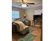 Comfortable bedroom with a daybed, accent chair, and ample natural light at 3439 Swindell Rd, Lakeland, FL 33810