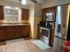 Well-equipped kitchen with stainless steel appliances, granite countertops, and dark wood cabinetry at 3439 Swindell Rd, Lakeland, FL 33810