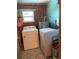 Laundry room with washer, dryer, and patterned flooring at 3439 Swindell Rd, Lakeland, FL 33810