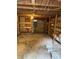 Unfinished basement providing ample storage space with built in shelving at 5418 Brownell St, Orlando, FL 32810