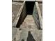 Exterior concrete steps lead down to a walk-out basement at 5418 Brownell St, Orlando, FL 32810