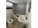 Bathroom with tiled shower and a pedestal sink at 5418 Brownell St, Orlando, FL 32810