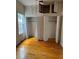 Bedroom with wood floors, built-in closets and overhead storage at 5418 Brownell St, Orlando, FL 32810