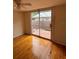 Bedroom with wood floors and a sliding glass door leading to deck at 5418 Brownell St, Orlando, FL 32810