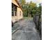Long concrete driveway leads to a fenced backyard at 5418 Brownell St, Orlando, FL 32810