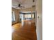 Bright living room with hardwood floors and access to other rooms at 5418 Brownell St, Orlando, FL 32810