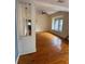 Open living room with wood floors and doorway view to the kitchen at 5418 Brownell St, Orlando, FL 32810