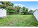 Spacious backyard featuring a storage shed and partial fencing at 1304 E Myrtle St, Lakeland, FL 33801