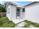 Back exterior view of house with door and awning at 1304 E Myrtle St, Lakeland, FL 33801