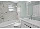 Stylish bathroom with a marble-tiled shower, modern vanity, and sleek fixtures at 1304 E Myrtle St, Lakeland, FL 33801