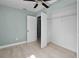 Bedroom with a closet with wire shelves and access to an ensuite at 1304 E Myrtle St, Lakeland, FL 33801