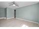 Bright bedroom with a ceiling fan, laminate flooring, and a relaxing atmosphere at 1304 E Myrtle St, Lakeland, FL 33801