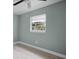 This bright bedroom is enhanced with wood-look floors and a window providing natural light at 1304 E Myrtle St, Lakeland, FL 33801