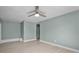 Spacious bedroom featuring laminate flooring, a ceiling fan, and a neutral color palette at 1304 E Myrtle St, Lakeland, FL 33801