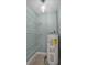 Utility room features storage shelves and a hot water tank at 1304 E Myrtle St, Lakeland, FL 33801