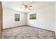 Bedroom with a ceiling fan, and two windows providing natural light at 201 W New York Ave, Orange City, FL 32763