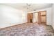 Spacious bedroom featuring a ceiling fan, ensuite bathroom, and walk-in closet at 201 W New York Ave, Orange City, FL 32763