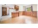 Kitchen featuring wood cabinetry, and a breakfast bar at 201 W New York Ave, Orange City, FL 32763