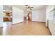 Bright living room featuring hardwood floors, ceiling fan and natural light at 201 W New York Ave, Orange City, FL 32763