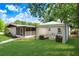 Spacious backyard with a gazebo lounge area, perfect for outdoor living at 223 Pinehurst Dr, Auburndale, FL 33823