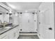 Bathroom featuring a glass enclosed shower and updated finishes at 223 Pinehurst Dr, Auburndale, FL 33823