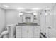 Bathroom featuring black granite countertops and a glass enclosed shower at 223 Pinehurst Dr, Auburndale, FL 33823