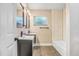 Bathroom with double vanity and tub at 223 Pinehurst Dr, Auburndale, FL 33823