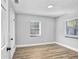 Bright, empty bedroom with laminate floors and lots of light at 223 Pinehurst Dr, Auburndale, FL 33823