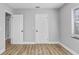 Bedroom with hard surface floors and updated paint at 223 Pinehurst Dr, Auburndale, FL 33823