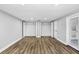 Bedroom with wood-look floors, two closets, and recessed lights at 223 Pinehurst Dr, Auburndale, FL 33823