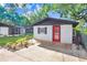 Attractive exterior of the home highlighting the vibrant red front door and landscaping at 223 Pinehurst Dr, Auburndale, FL 33823