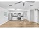 Modern kitchen features stainless steel appliances, white cabinetry, and sleek countertops at 223 Pinehurst Dr, Auburndale, FL 33823