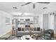 Open living room with a well-appointed kitchen, a comfortable sofa, and stylish decor at 223 Pinehurst Dr, Auburndale, FL 33823