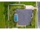 An aerial view of a home with a private pool and spacious, fenced backyard at 2973 Blackwater Creek Dr, Lakeland, FL 33810