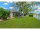 View of the backyard, pool, and screen, and mature trees at 2973 Blackwater Creek Dr, Lakeland, FL 33810