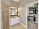 Bathroom featuring granite countertop, walk in shower, and access to walk-in closet at 2973 Blackwater Creek Dr, Lakeland, FL 33810