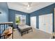 A bright bedroom with a ceiling fan, two closets and view to backyard through window at 2973 Blackwater Creek Dr, Lakeland, FL 33810