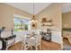 Bright dining area with view to the pool, perfect for intimate meals and relaxation at 2973 Blackwater Creek Dr, Lakeland, FL 33810